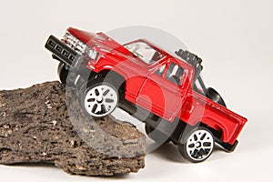 Ford 4x4 Pickup Climbing a Rock