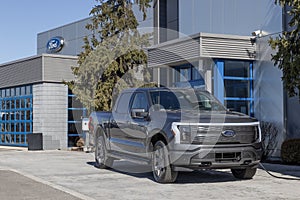 Ford F-150 Lightning display. Ford offers the F150 Lightning all-electric truck in Pro, XLT, Lariat, and Platinum models