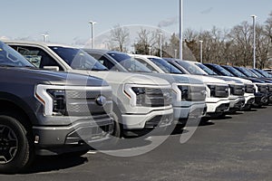 Ford F-150 Lightning display. Ford offers the F150 Lightning all-electric truck in Pro, XLT, Lariat, and Platinum models