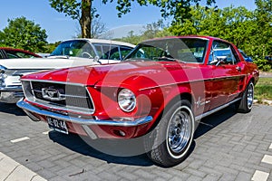 1967 Ford Mustang classic sports car on the parking lot in Rosmalen, The Netherlands - May 8, 2016