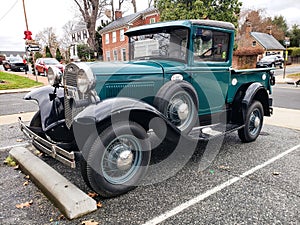 Ford pickup, Model A, in a city parking lot