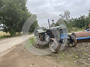 Fordson tractor parked up by the side of the road