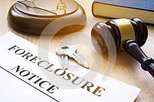 Foreclosure notice and keys on a court table.