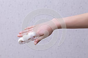 Forefinger finger immobilizer after hand injury. Retainer for recovery the hand