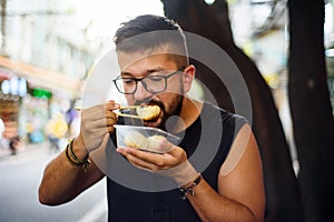 Foreigner eating street food in China