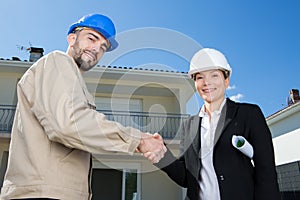 foreman and architect shaking hands