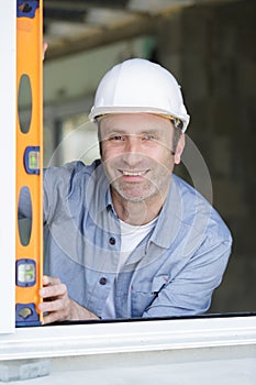 foreman checking accuracy with level