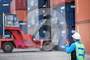 Foreman control forklift handling the container box