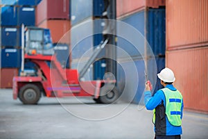 Foreman control forklift handling the container box