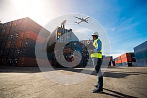 Foreman control loading Containers box to truck