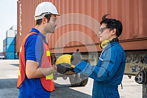 Foreman and dock worker staff showing thumbs up working at Container cargo harbor. Business Logistics import export shipping