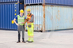 Foreman and engineer logistic containers export and import in cargo ship.