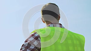 Foreman inspecting construction site before starting demolition and installation