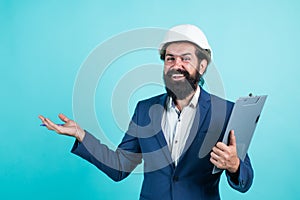 Foreman inspector. working on construction project. happy man with beard wear hard hat. concept of engineering