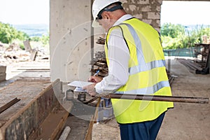 Foreman officer inspector, building Inspector, engineer or inspector at construction site checking and inspecting