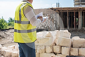 Foreman officer inspector, building Inspector, engineer or inspector at construction site checking and inspecting