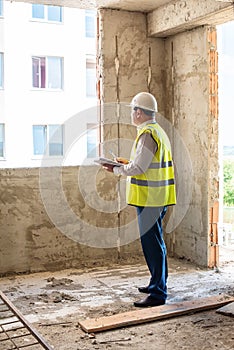 Foreman officer inspector, building Inspector, engineer or inspector at construction site checking and inspecting