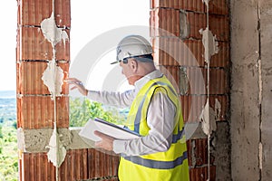 Foreman officer inspector, building Inspector, engineer or inspector at construction site checking and inspecting