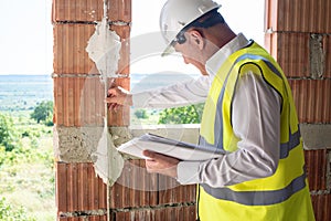 Foreman officer inspector, building Inspector, engineer or inspector at construction site checking and inspecting