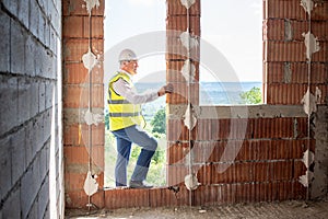 Foreman officer inspector, building Inspector, engineer or inspector at construction site checking and inspecting