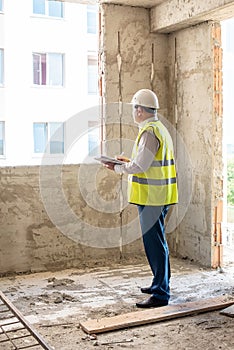 Foreman officer inspector, building Inspector, engineer or inspector at construction site checking and inspecting