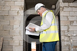 Foreman officer inspector, building Inspector, engineer or inspector at construction site checking and inspecting