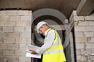 Foreman officer inspector, building Inspector, engineer or inspector at construction site checking and inspecting