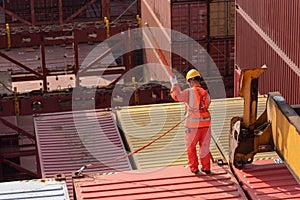 Foreman, port worker, assisting with cargo operations.