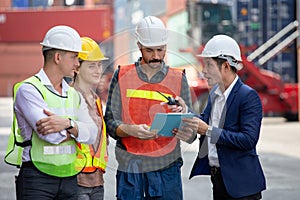 Foreman and secretary clipboard   meeting with worker to checking  control loading Containers box at warehouse logistic in Cargo