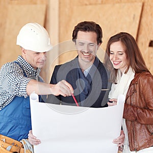 Foreman shows house plans