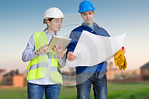 Foreman and student with blueprints
