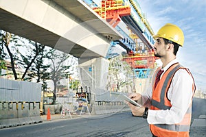 Foreman with tablet in the construction site