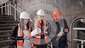 The foreman and two women inspectors visiting the construction site.