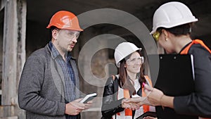 The foreman and two women inspectors visiting the construction site.