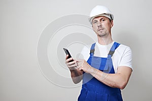 Foreman worker using smartphone on white background