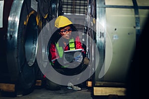 Foreman or worker work at factory site check up machine or products in site