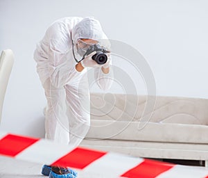 Forensic expert at crime scene doing investigation