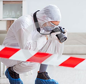 Forensic expert at crime scene doing investigation