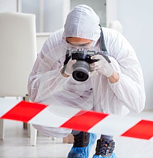 Forensic expert at crime scene doing investigation