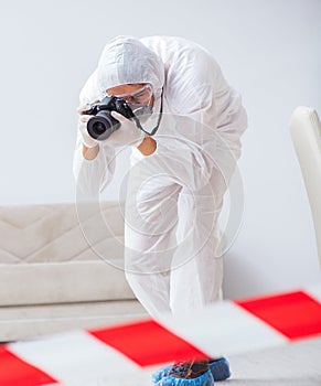 Forensic expert at crime scene doing investigation