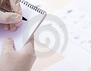 Forensic expert studying fingerprints in the lab