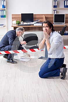 Forensic investigator investigating theft in the office