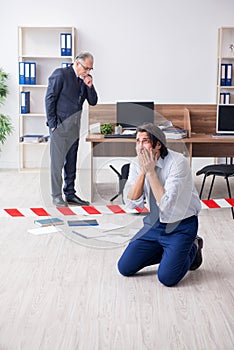 Forensic investigator investigating theft in the office