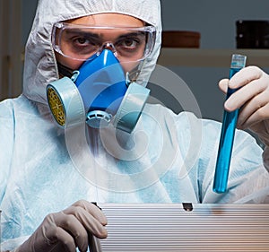 Forensic investigator working in lab looking for evidence