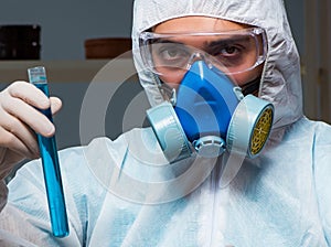 Forensic investigator working in lab looking for evidence