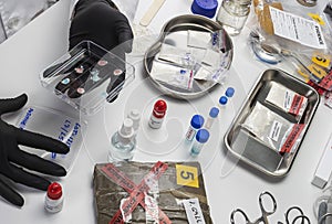 Forensic police analyse positive narcotic substances in petri dish in crime lab