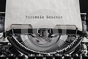 Forensic Science words typed on vintage typewriter. photo