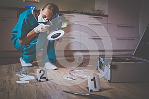 Forensic specialist  taking photos on a crime scene