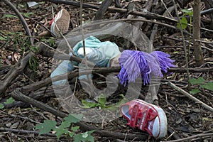 Forensics and investigation kid shoes in the forest photo