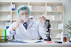 The forensics investigator working in lab on crime evidence